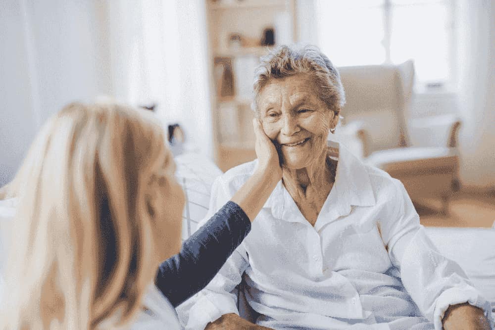 Family touring an assisted living facility with a staff member