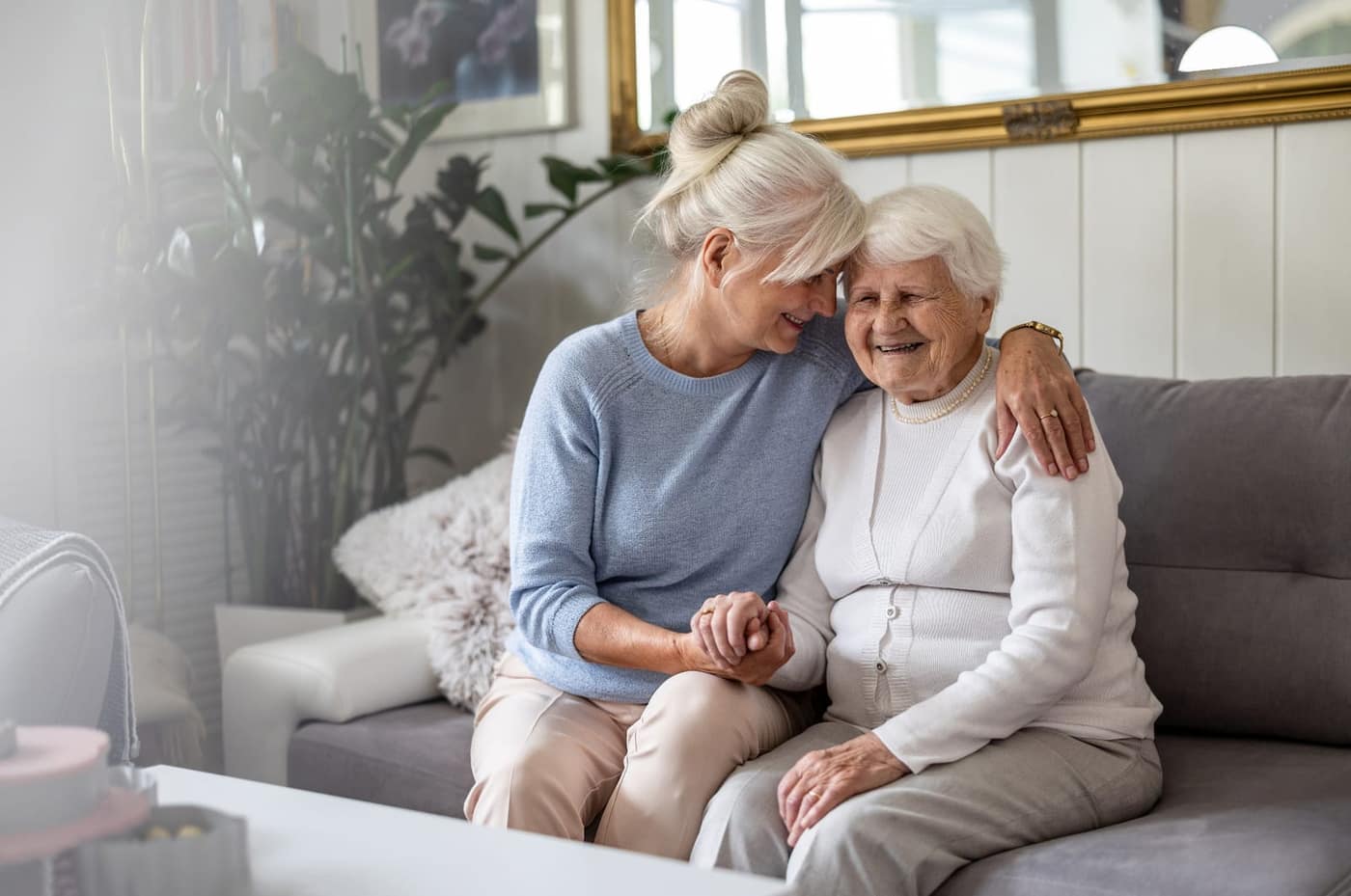 Senior couple embracing and smiling while planning for the future