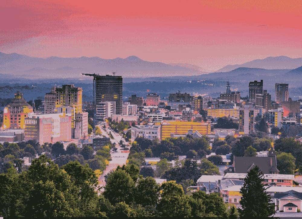 Asheville, North Carolina skyline with mountains at sunset